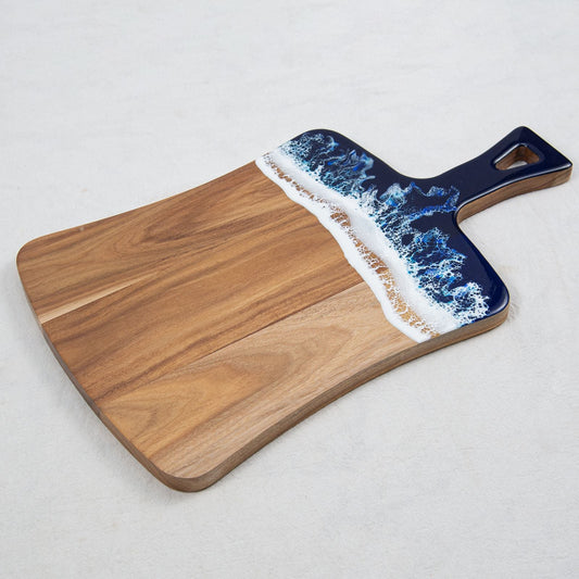 Paddle-style acacia board ideal for serving cheese and snacks