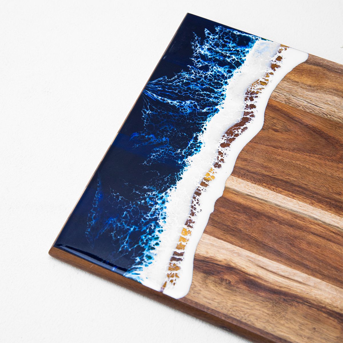 Angled side shot of handmade horizontal-style resin board