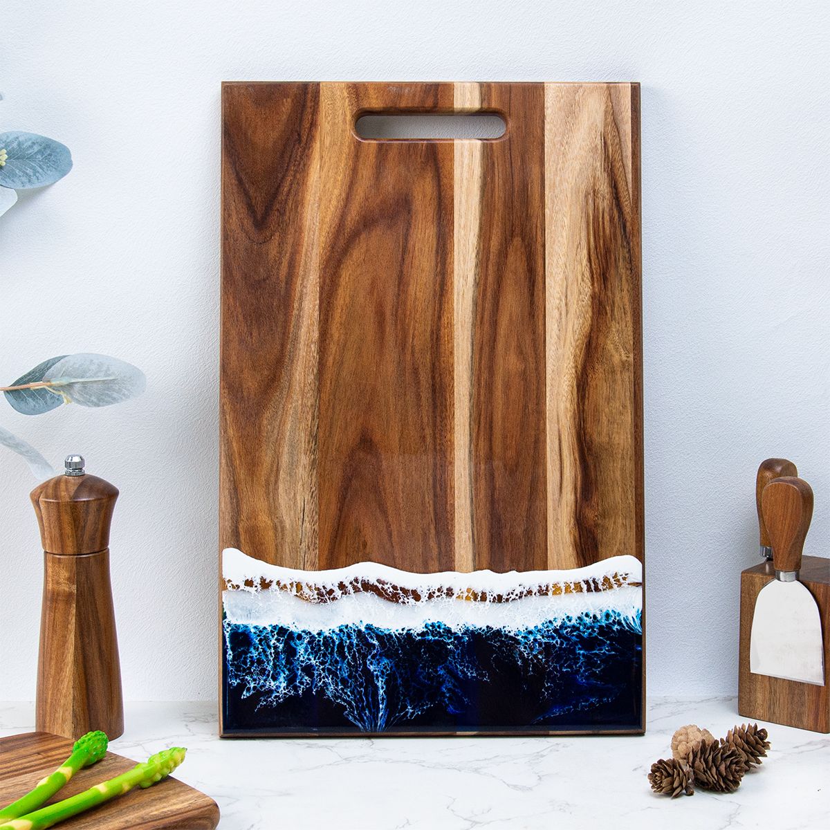 Close-up of glossy ocean resin art on acacia board surface 